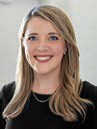 Headshot of Chelsea Leitch who has long light brown hair and is 
wearing a black blouse.